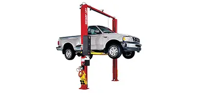 A two-post lift lifting a light-duty truck