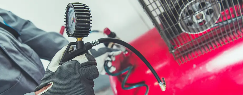 technician testing an air compressor valve