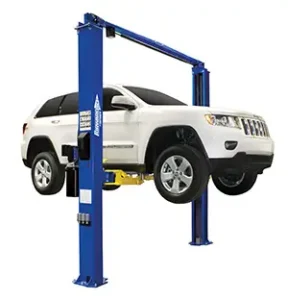 A white Jeep on a |10 forward lift two-post lift