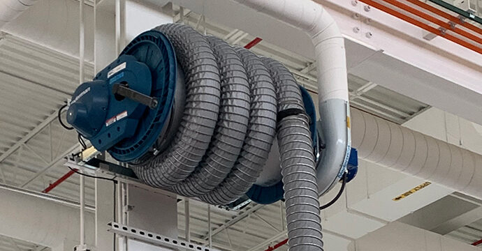 a hose reel-style exhaust removal system